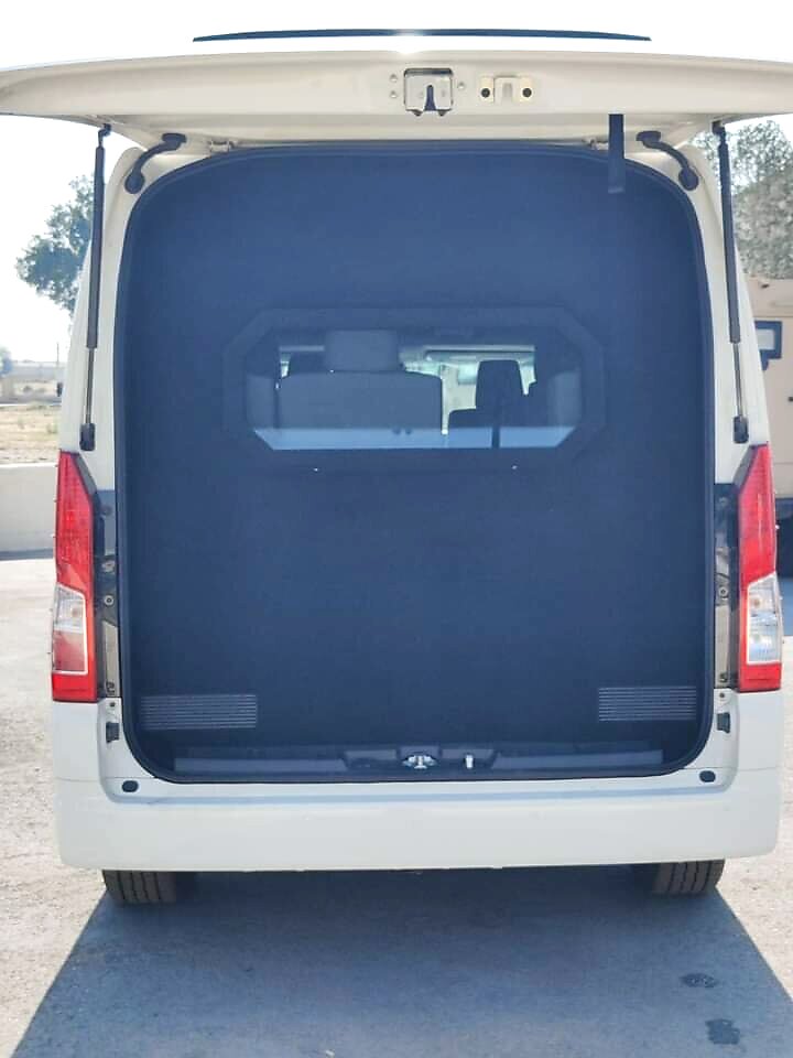Rear door of an armoured Hiace open, showing reinforced door lining