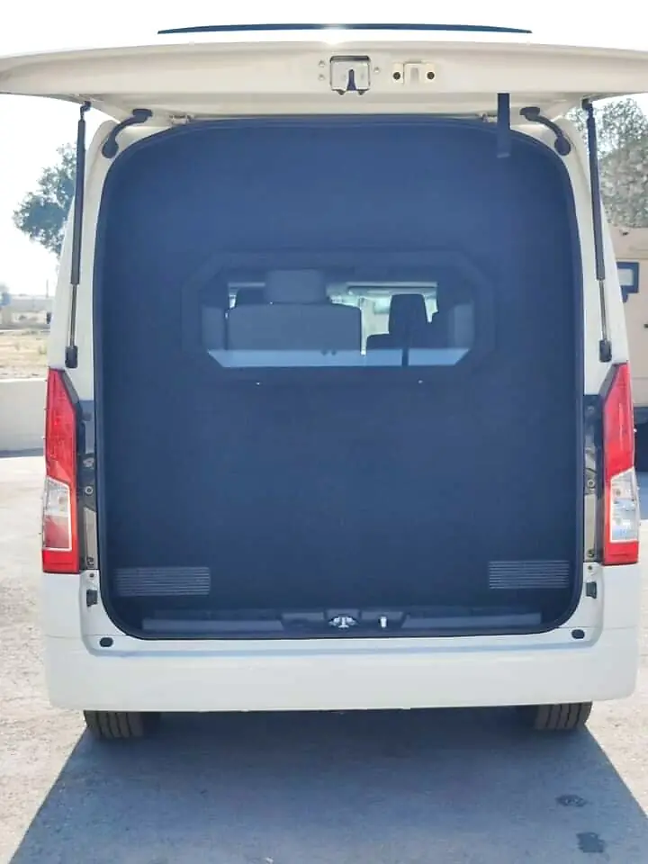 Rear door of an armoured Hiace open, showing reinforced door lining